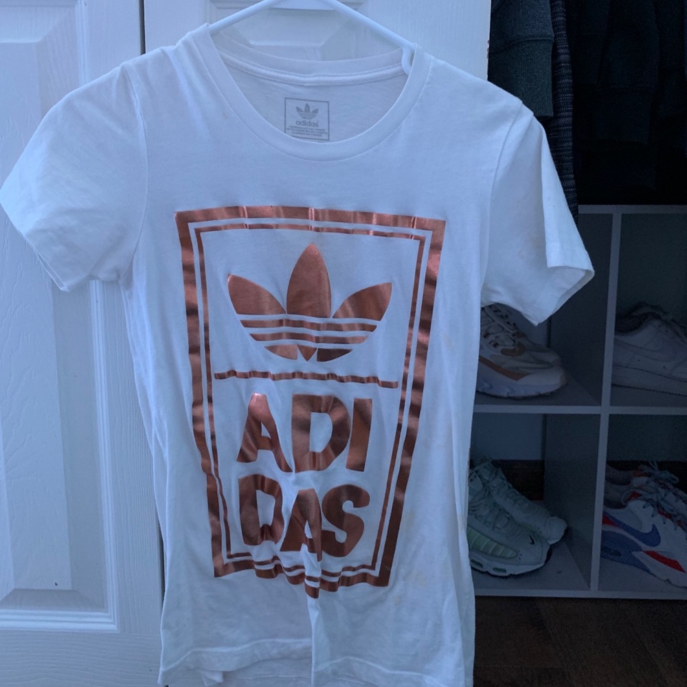 white t shirt with gold adidas logo